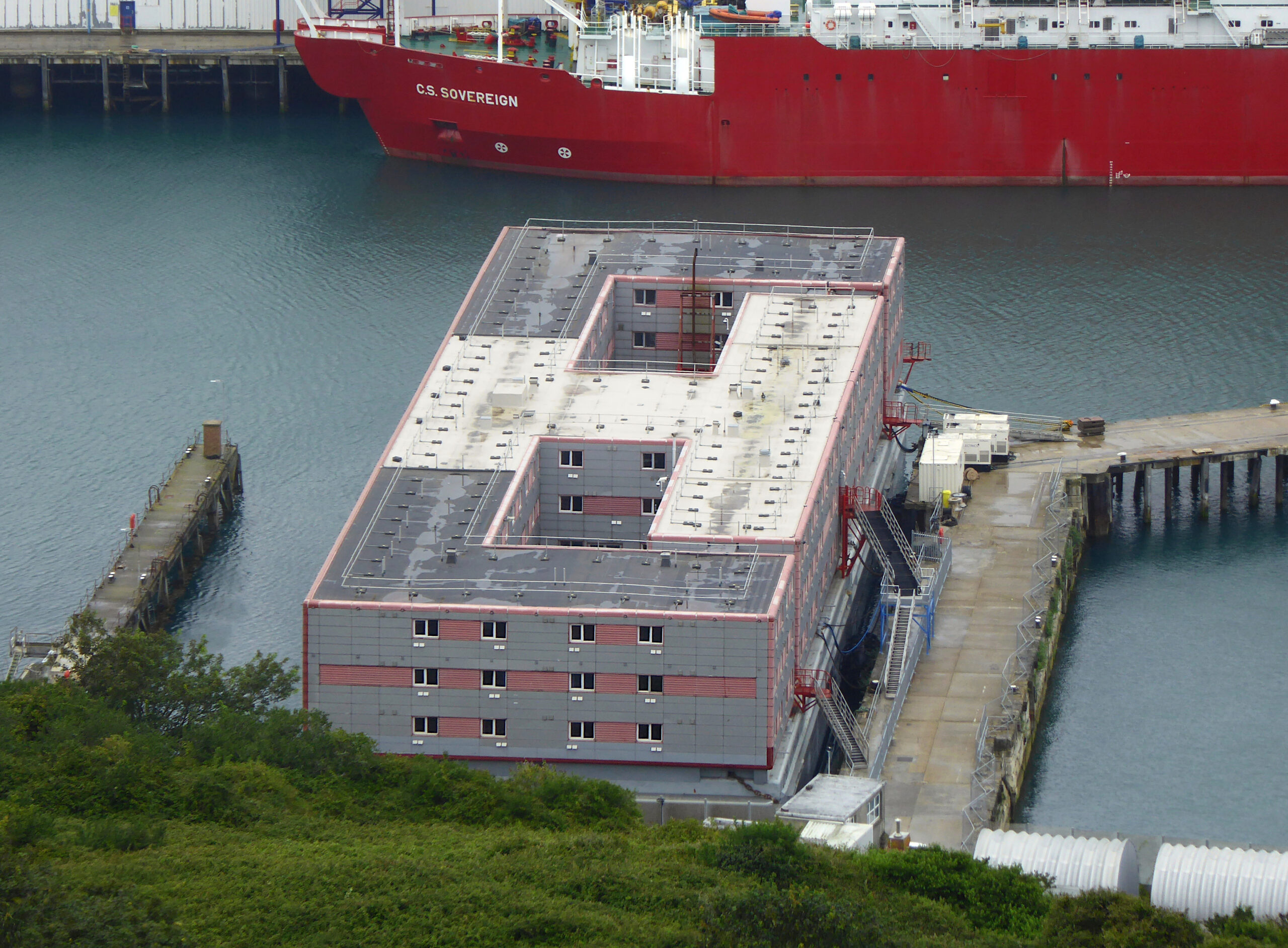 A Photo of Bibby Stockholm in Portland Port, 2023. Photo is taken from above.