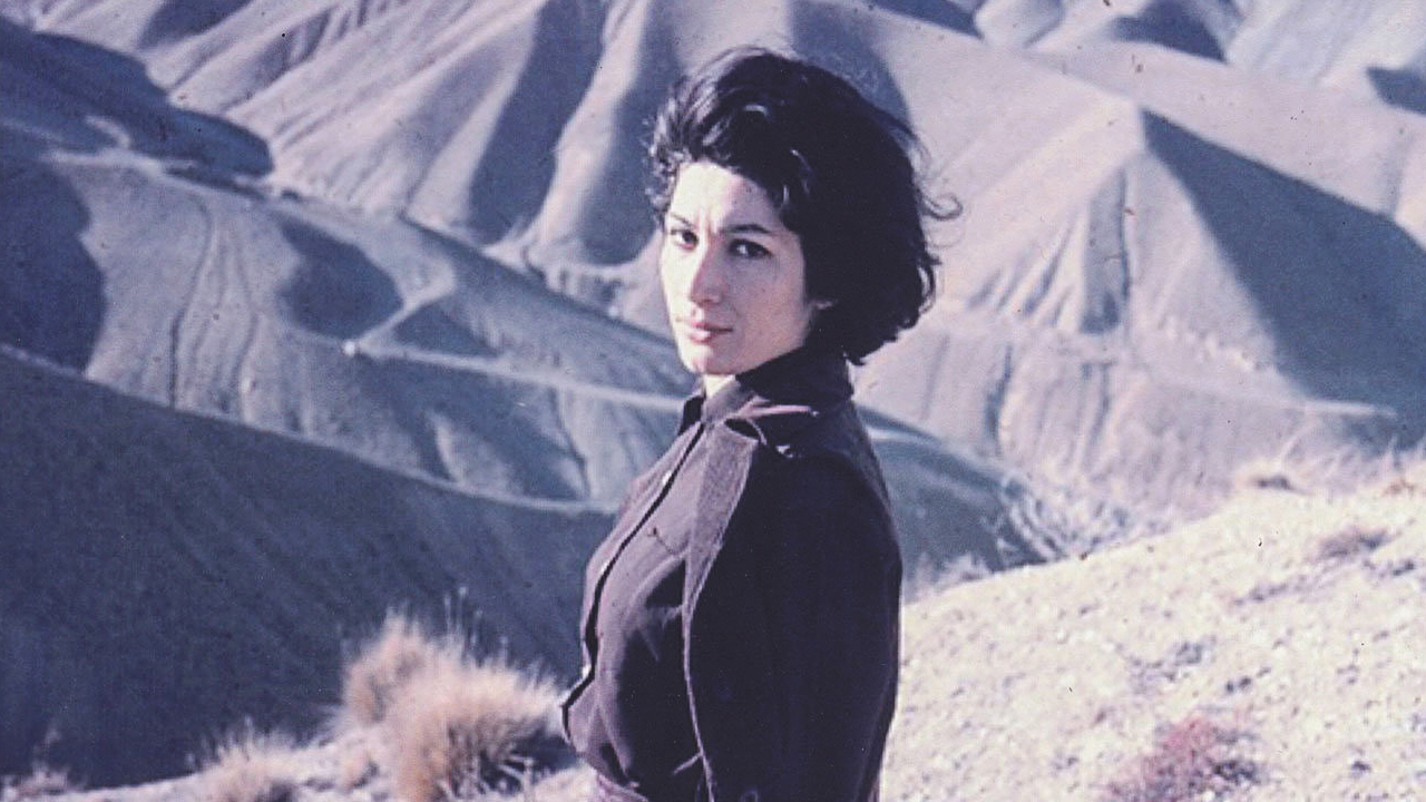Polaroid portrait of Forough Farrokhzad outside, looking directly at the camera.